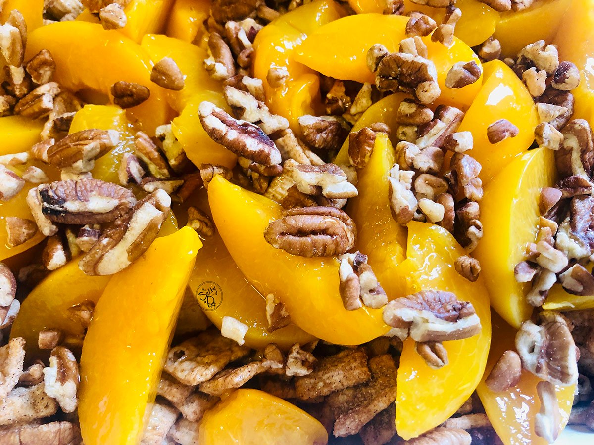 Pecans on top of peaches.