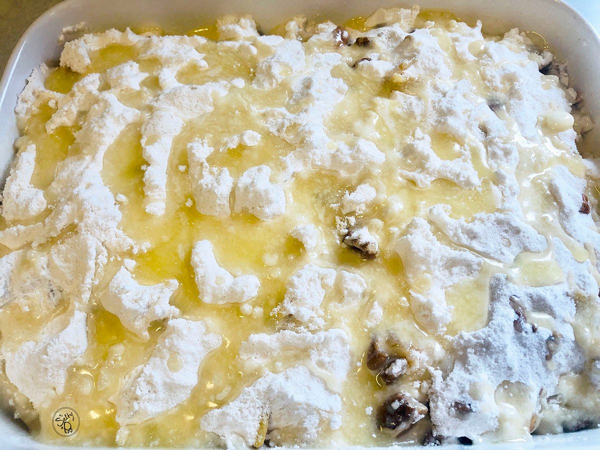 Melted butter drizzled on top of the cake mix.