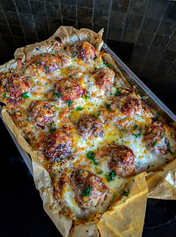 Yummy sausage meatball sliders resting from out of the oven.