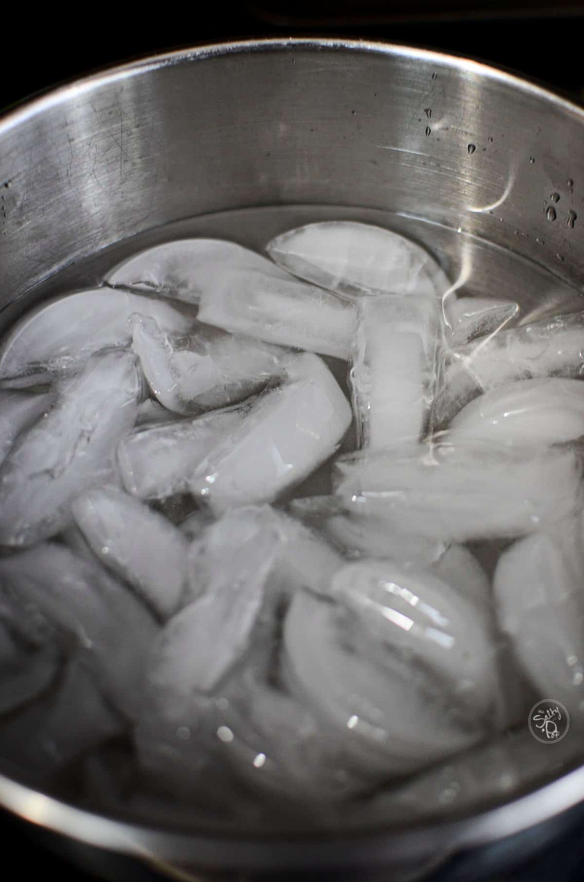 A bowl full of ice with water