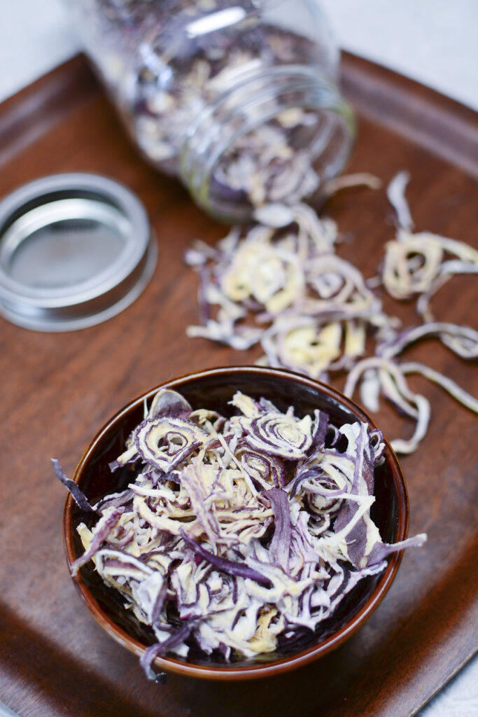 Dehydrated purple onion strands.