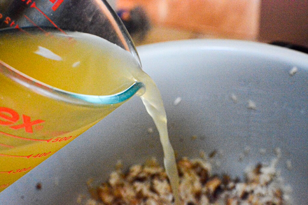 Chicken broth is added to the other ingredients. 