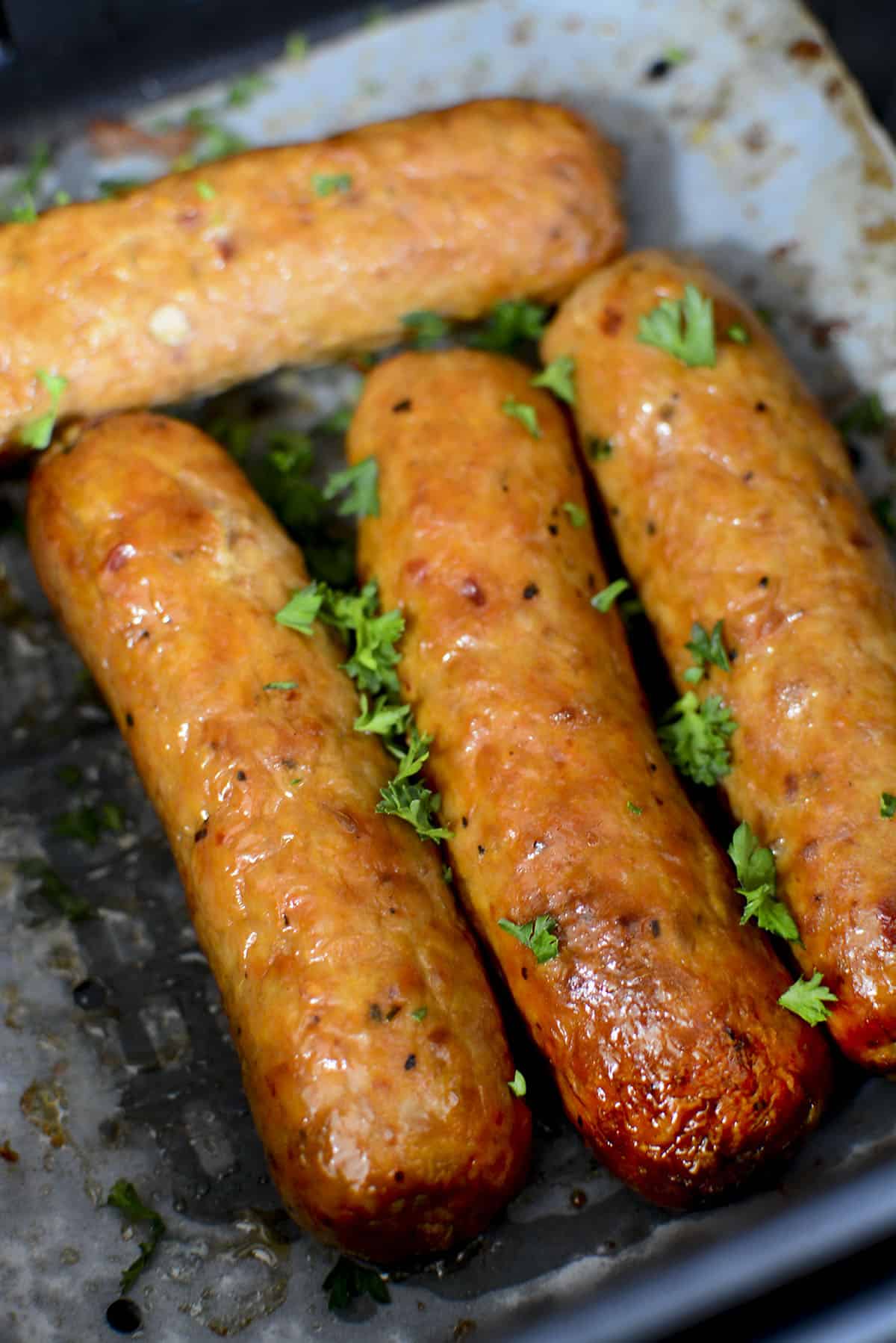 Four Air fried chicken sausages.