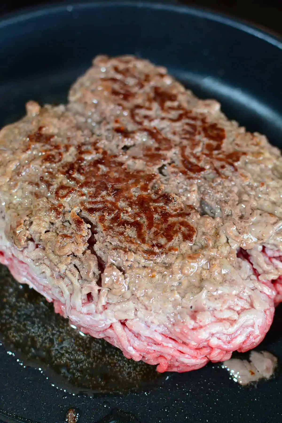 Seared ground beef from a thawed state.