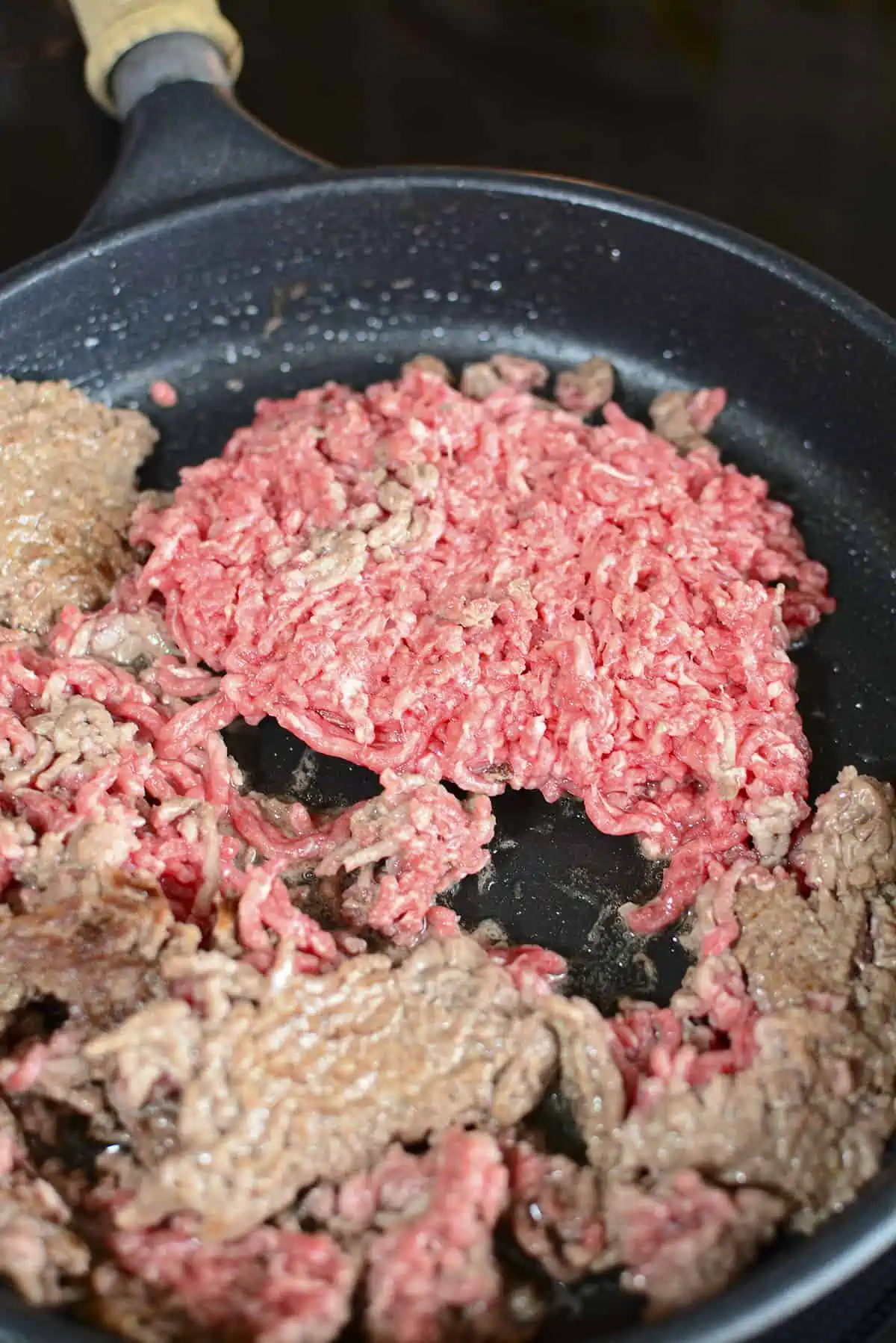 A small portion left of frozen ground beef after searing the sides multiple times. 