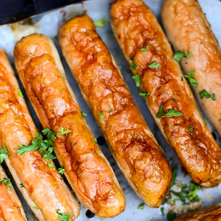 air fryer breakfast sausage in the air fryer basket.