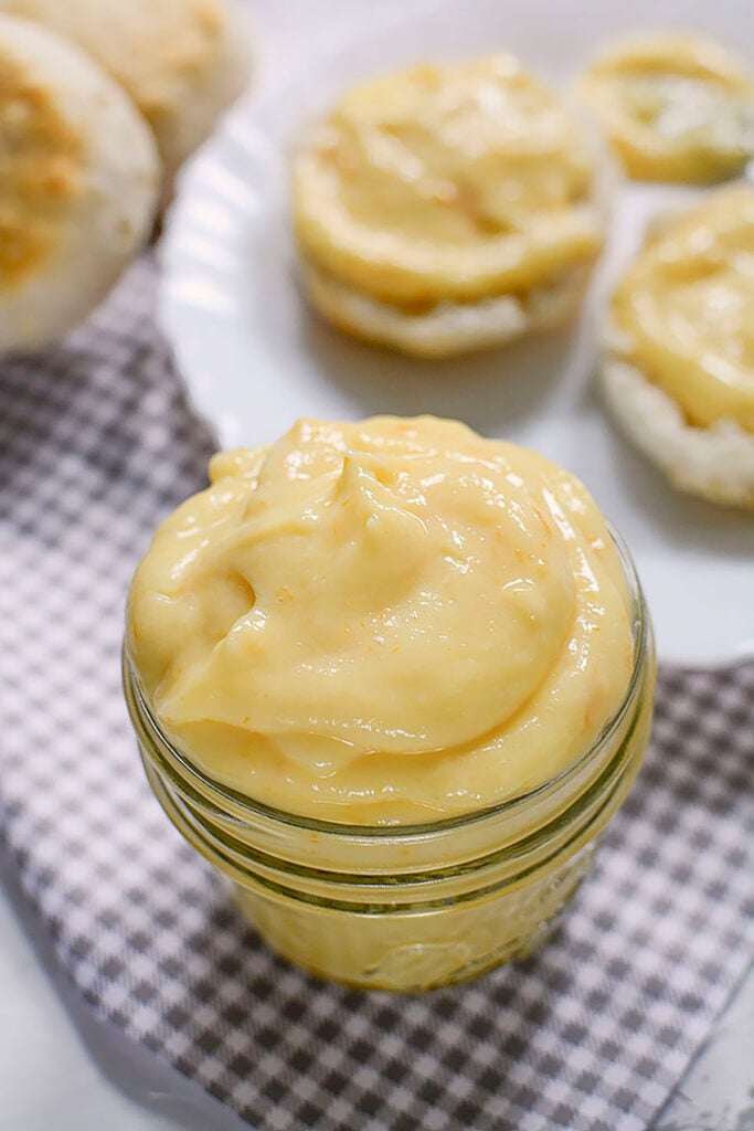 A close up of the lemon curd in a small glass mason jar.