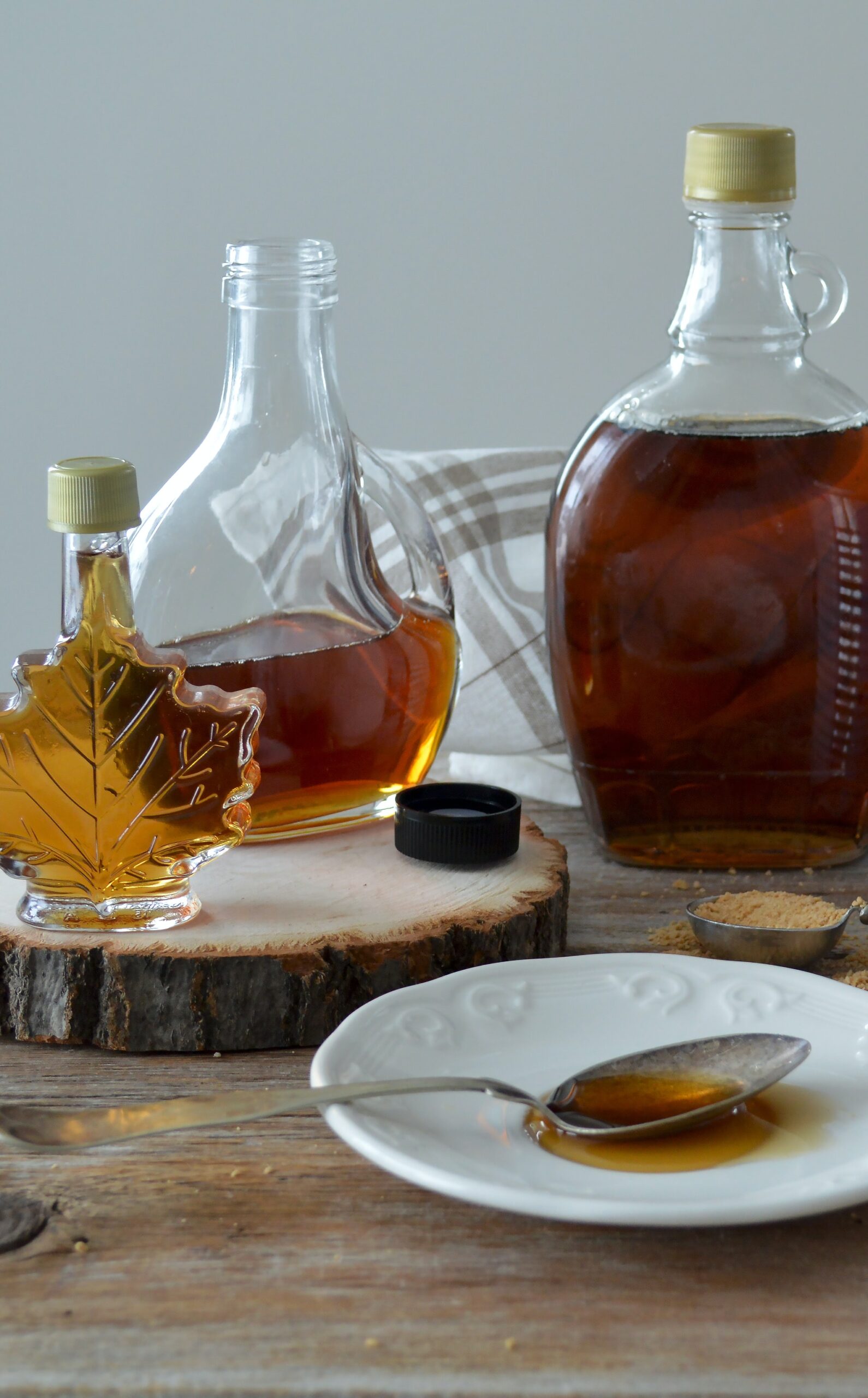 Different bottles containing maple syrup