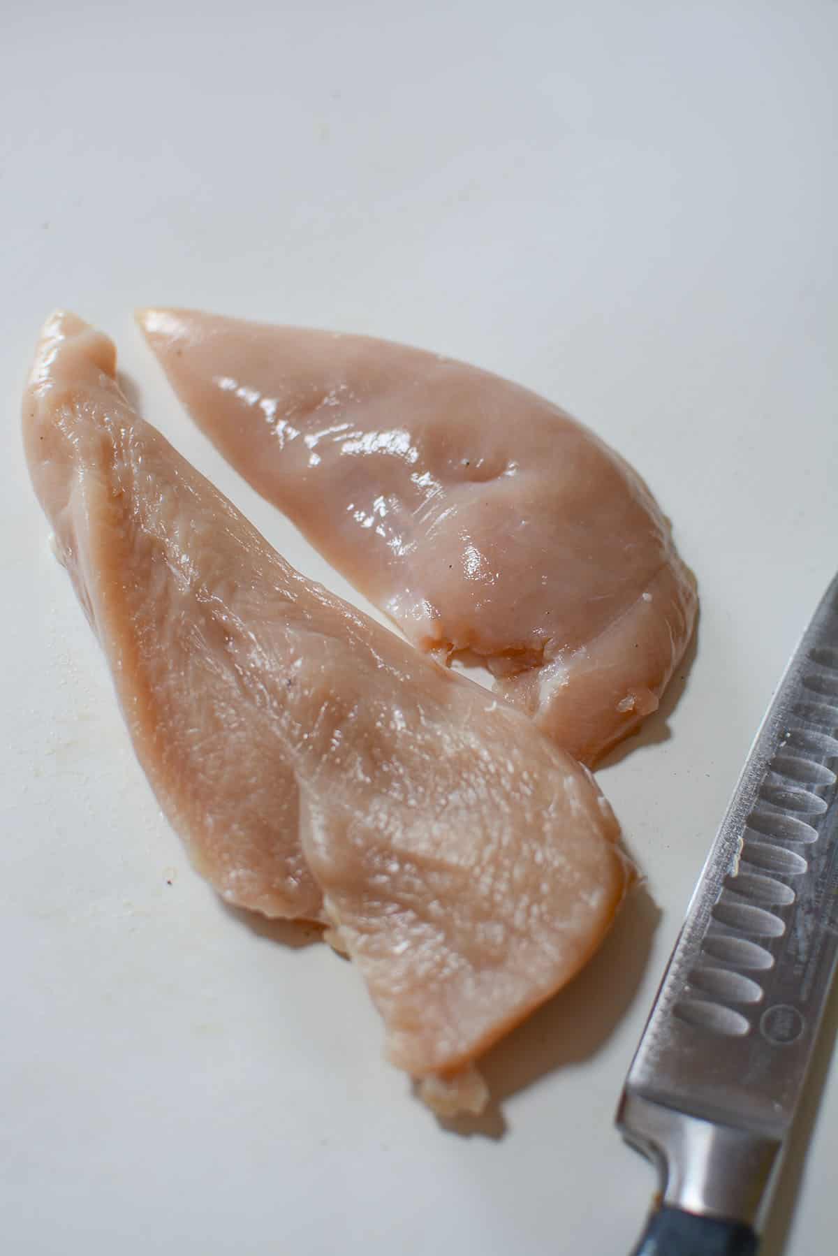 A chicken breast cut in two horizontally. 