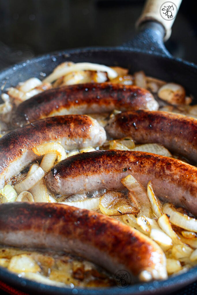 Brats added to the onions to finish cooking.