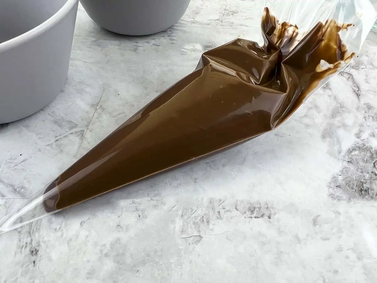 A piping bag filled with nutella.