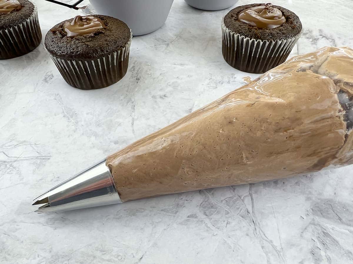 Cupcake frosting in a piping bag.