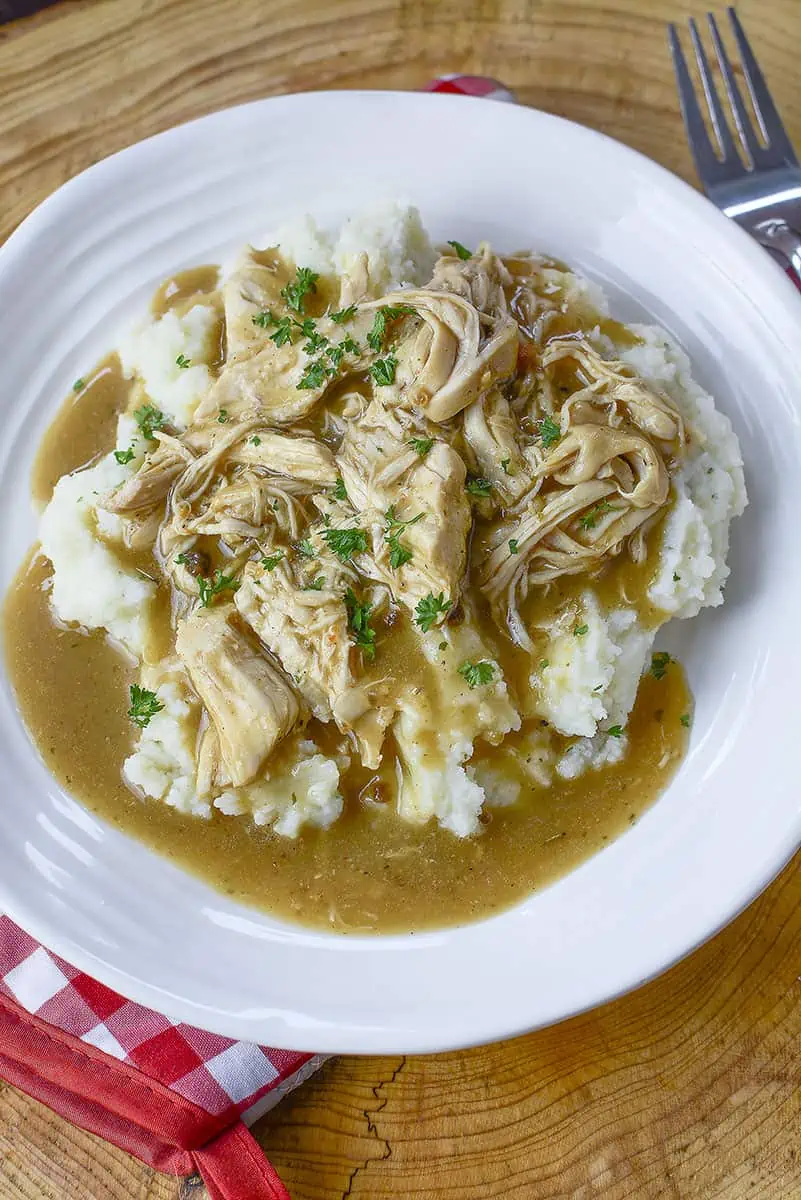 3 envelope chicken in a plate with a fork on the right side.