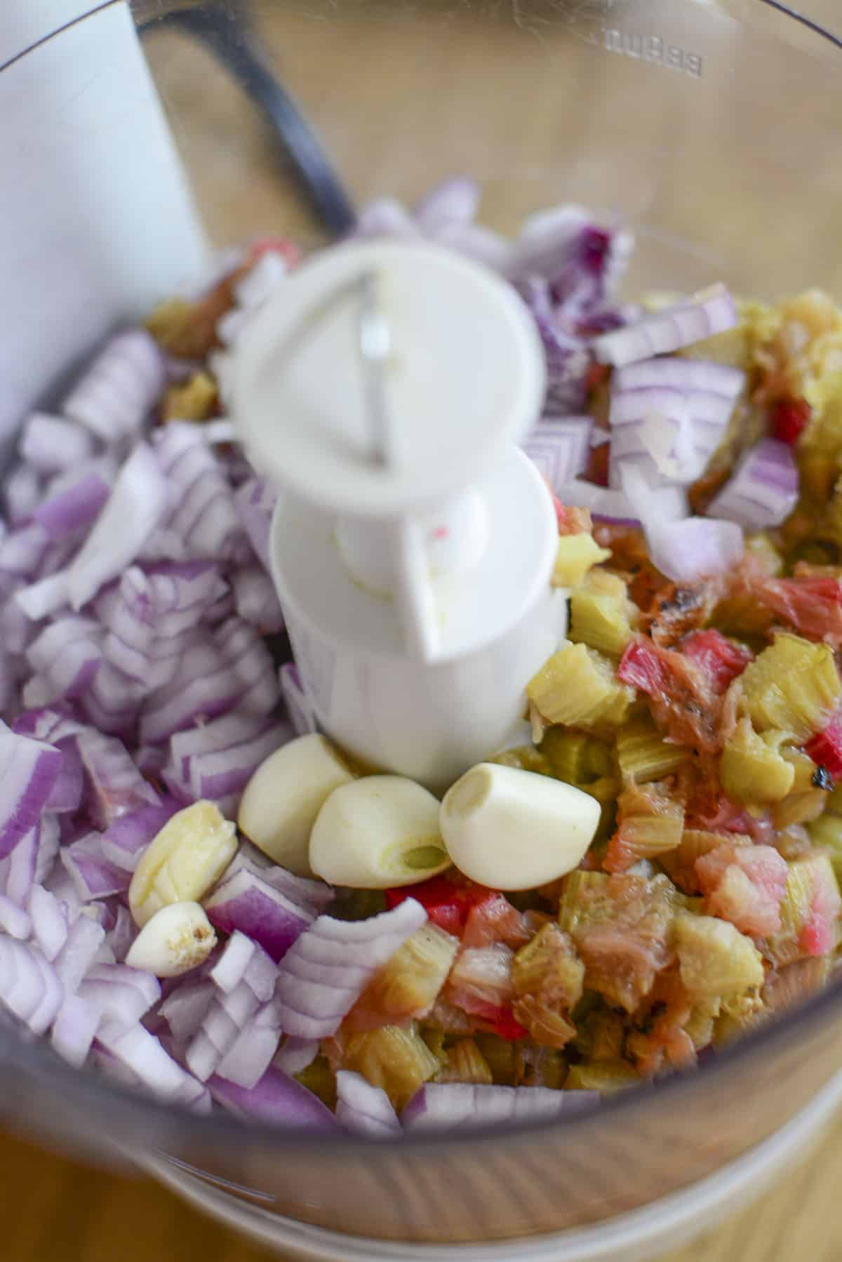 The rhubarb sauce ingredients in a food processor bowl waiting to be blended.