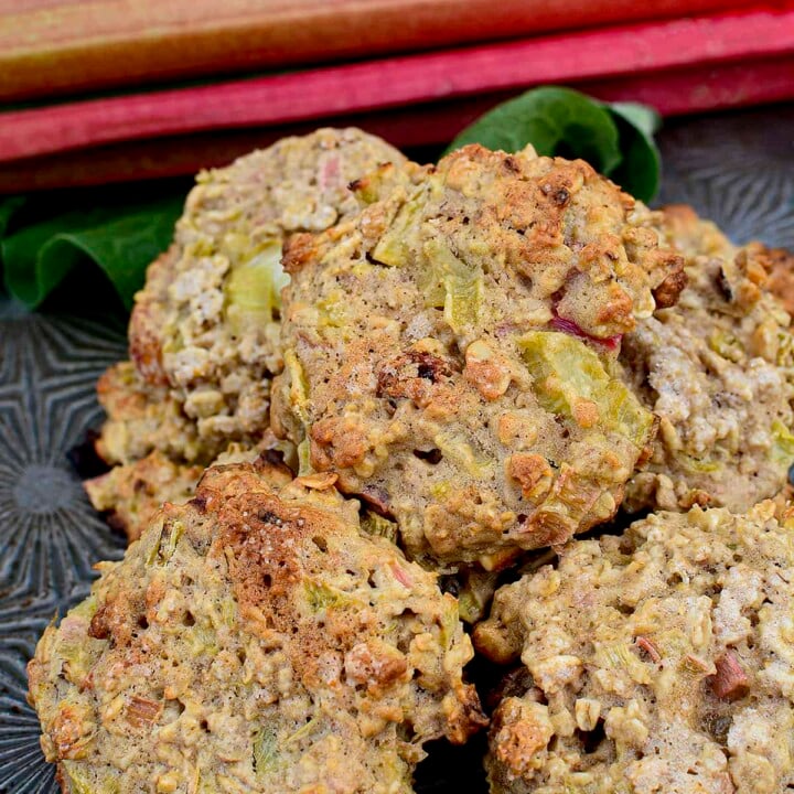 rhubarb cookies piled on eachother on a metal baking sheet.