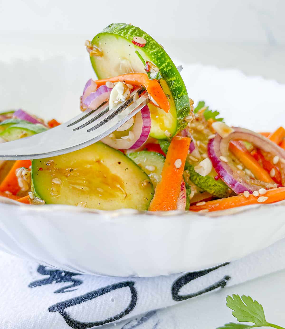 A forkful of the cucumber carrot salad.
