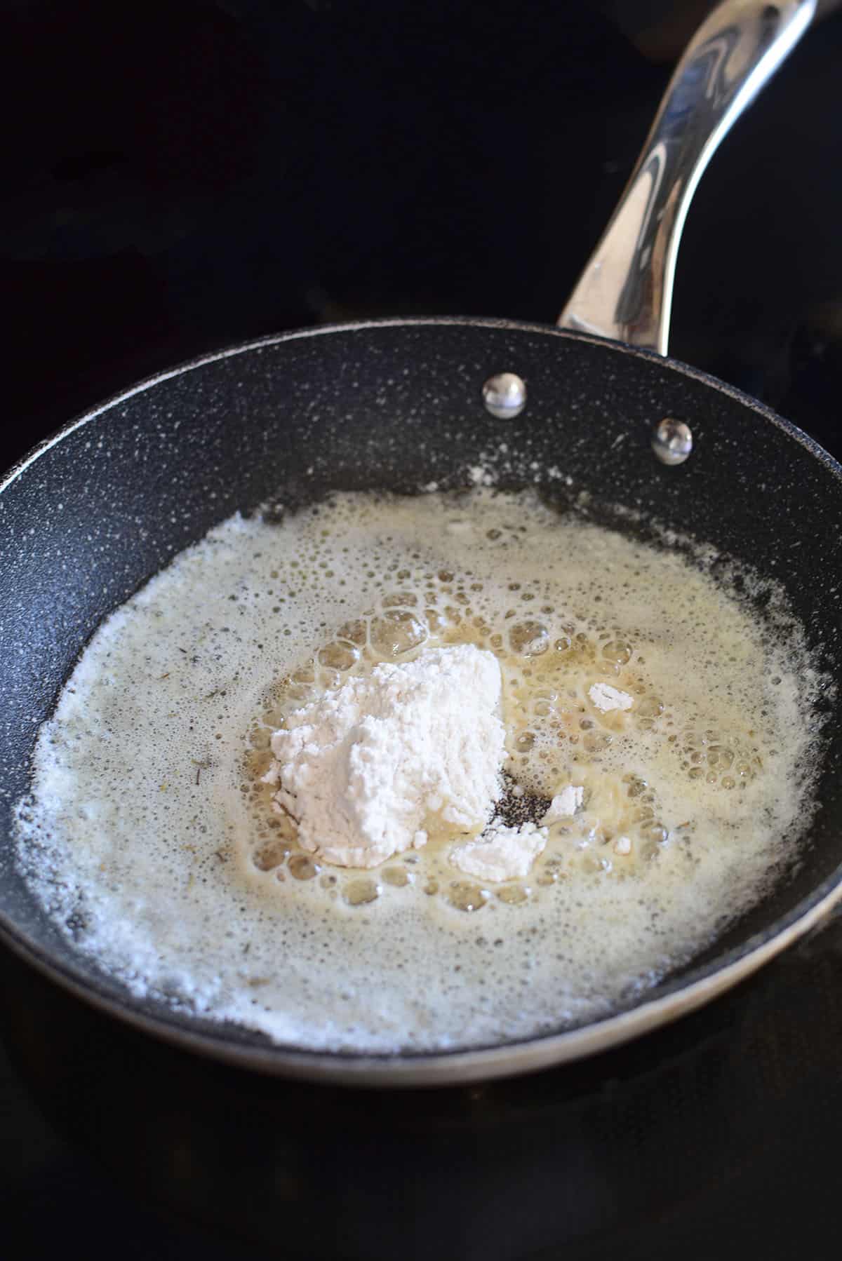 Starting to make the rue with melted butter and flour in the frying pan.
