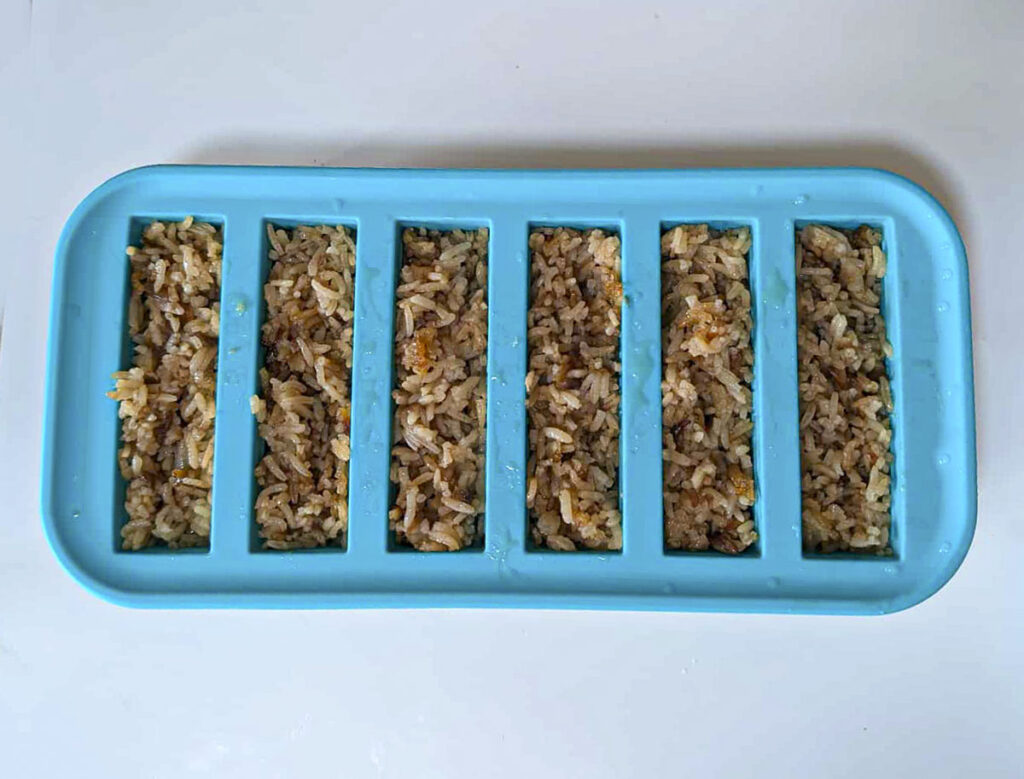 Stick of butter rice portioned into souper cubes.