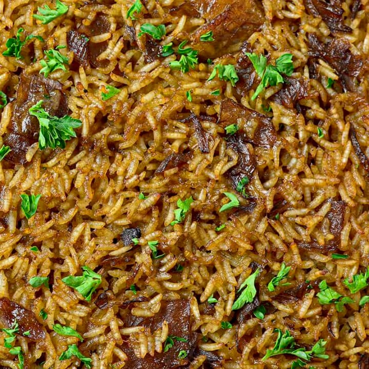 Stick of butter rice photographed up close garnished with parsley.