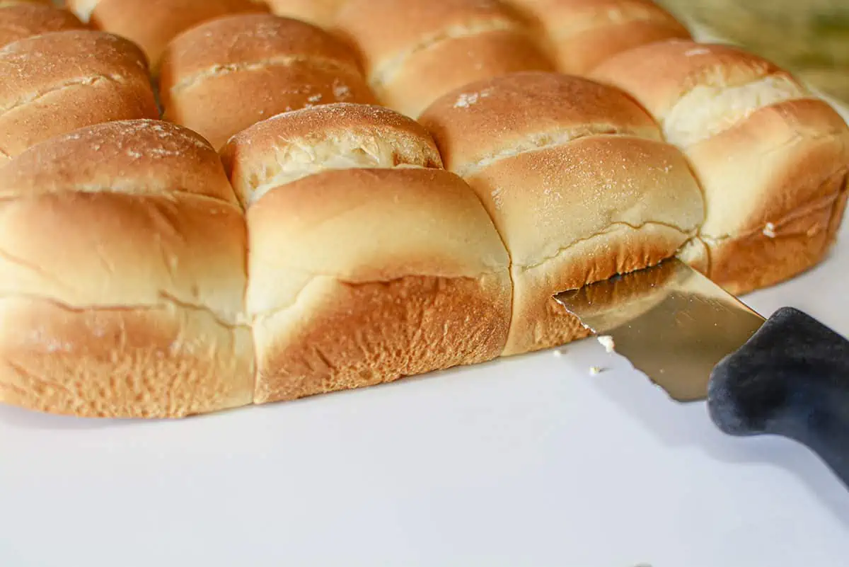 Cutting the tray buns in half.