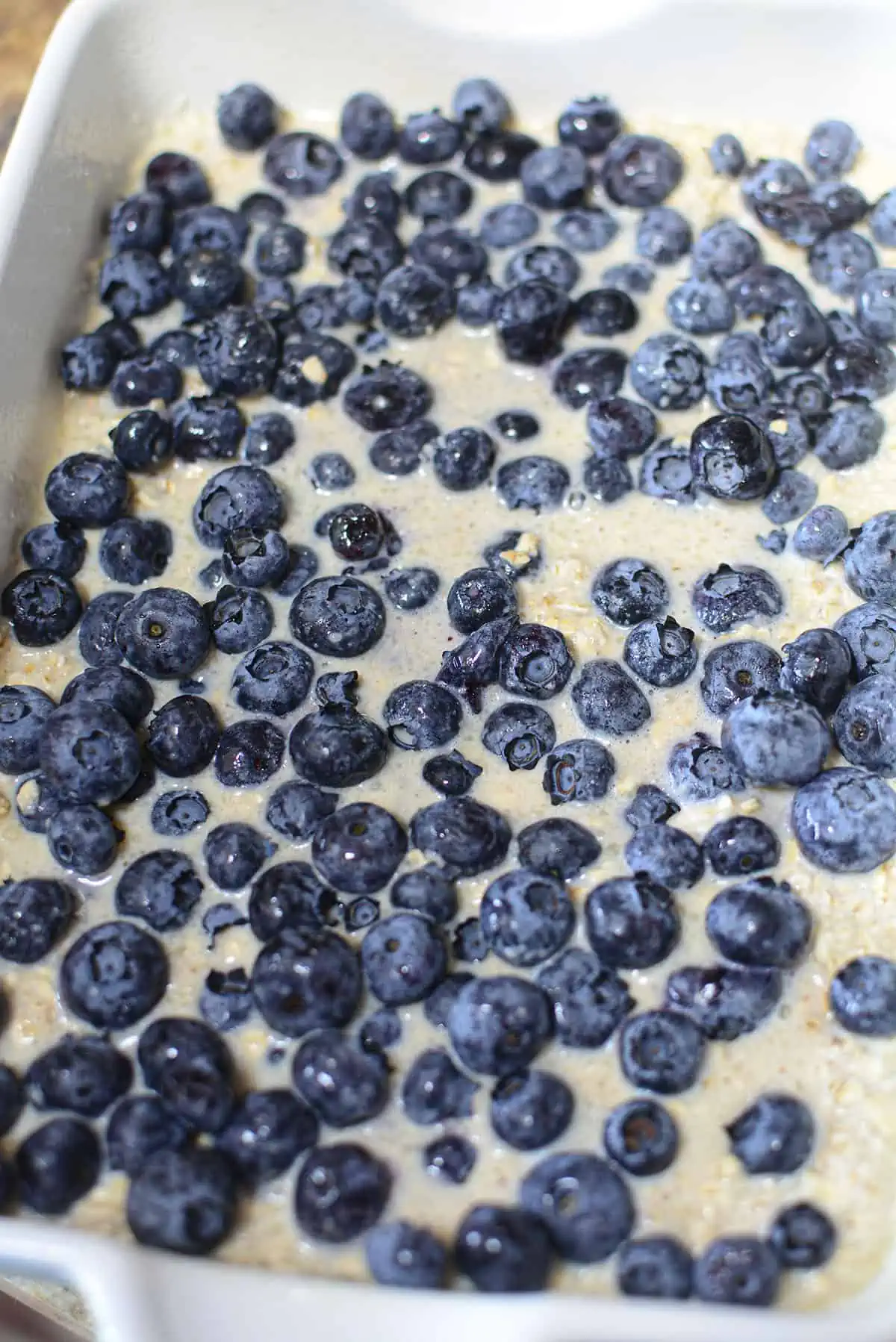 Blueberries on top of the first half of the oat batter.