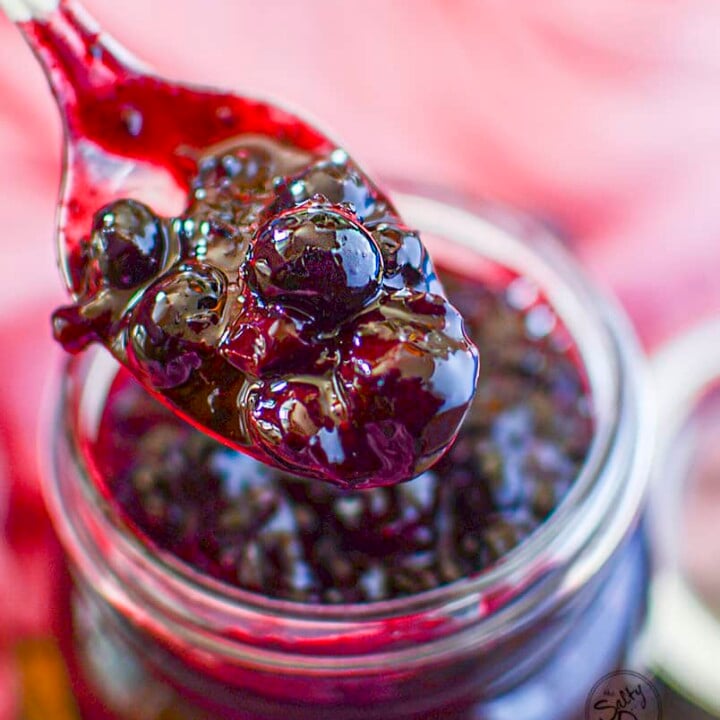 Blueberry pie filling on a spoon.