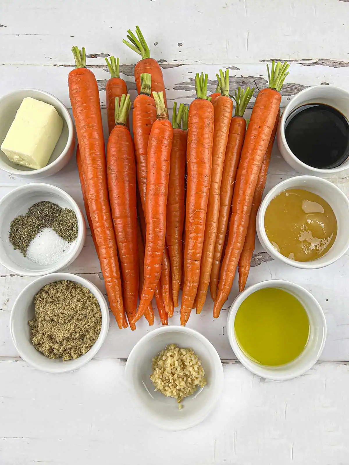 Ingredients for the honey glazed carrots. Carrots, balsamic vinegar, honey, oil, garlic, brown sugar, spics and butter.