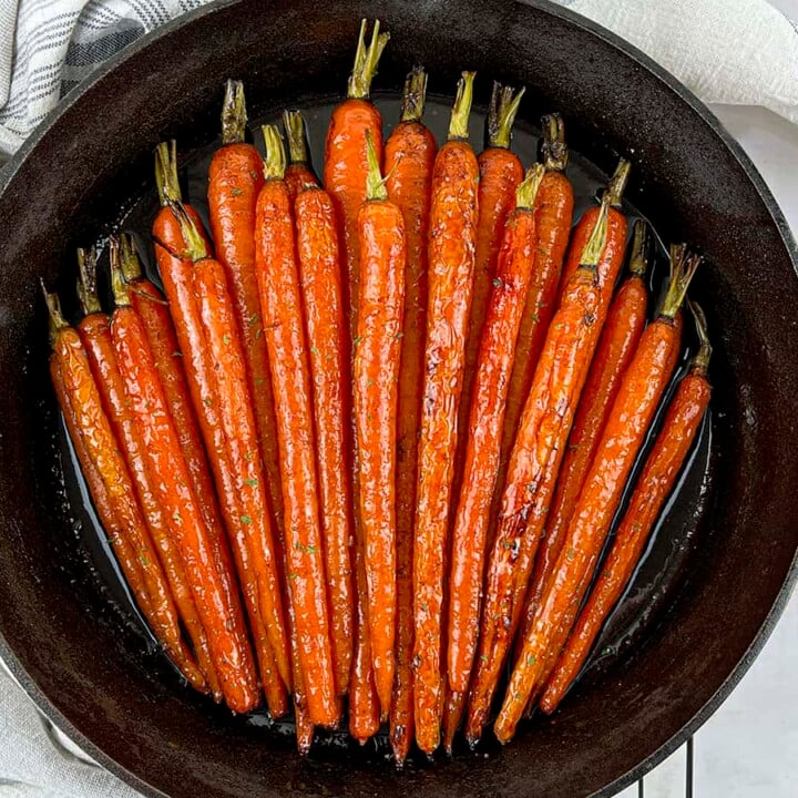 Honey roasted brown sugar carrots in a cast iron skillet.