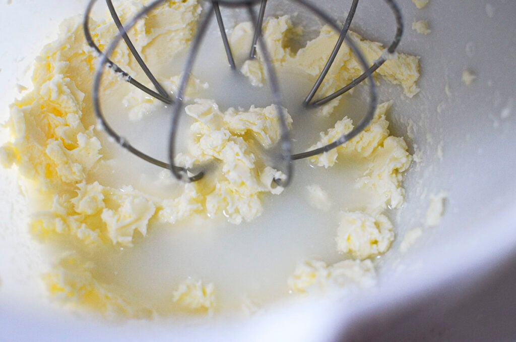 The whipped cream has gone past the point of being whipped and now formed butter.