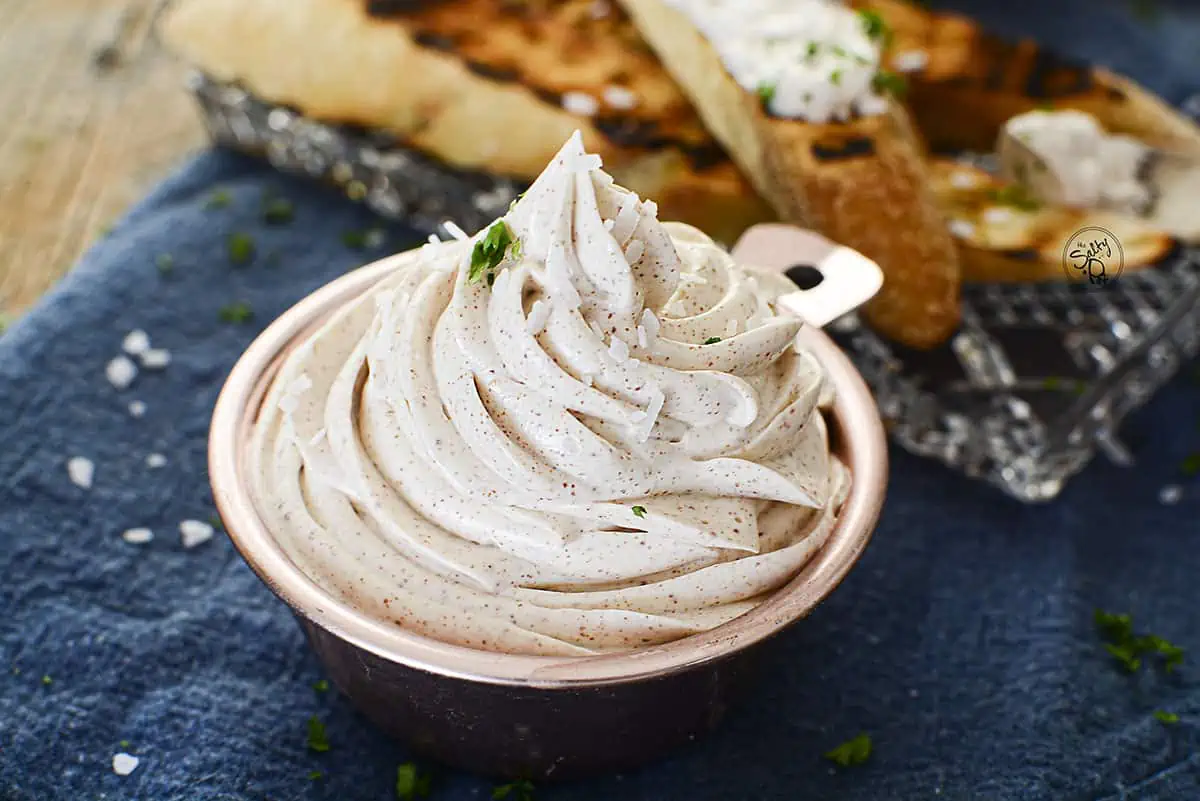 Whipped brown butter in a copper dish.