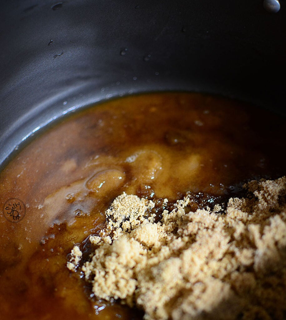 Brown sugar melting in a pot.