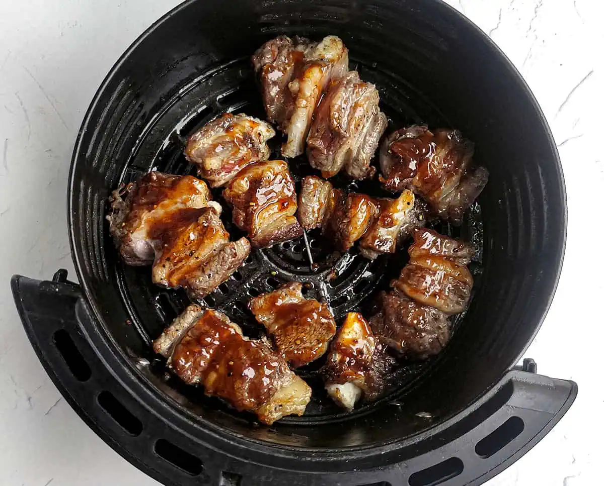 Air fried beef short ribs with bbq sauce brushed on them.