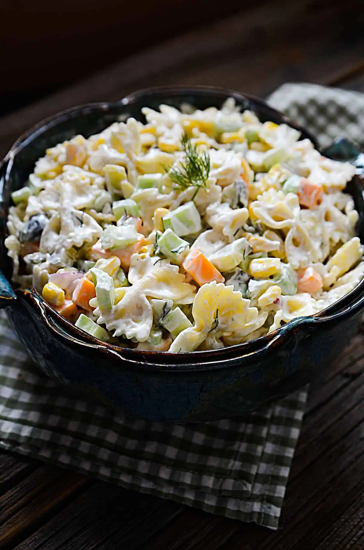 Bowtie pasta salad with veggies in a bowl. 
