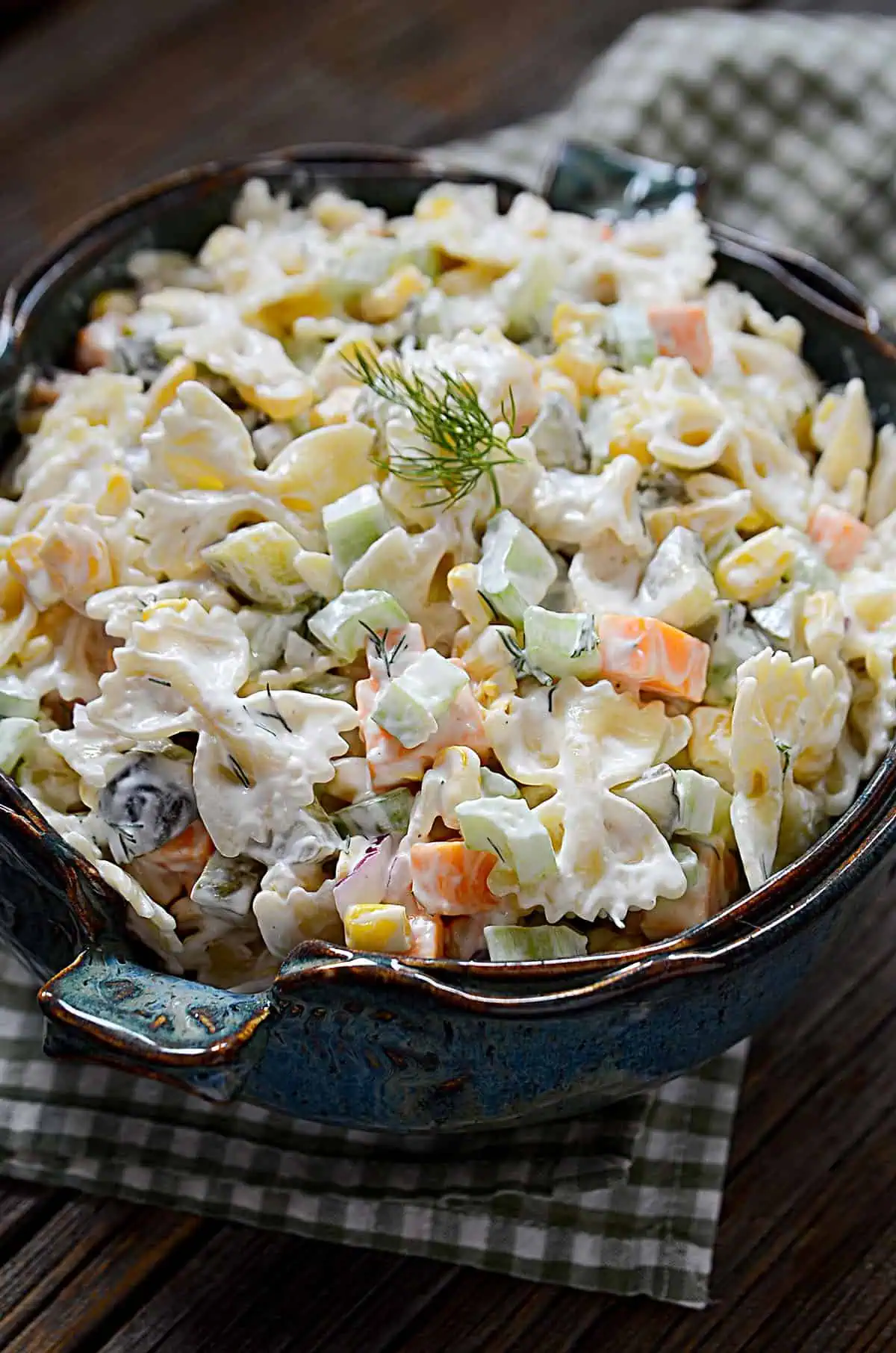 Dill pickle pasta salad in a pottery bowl. 