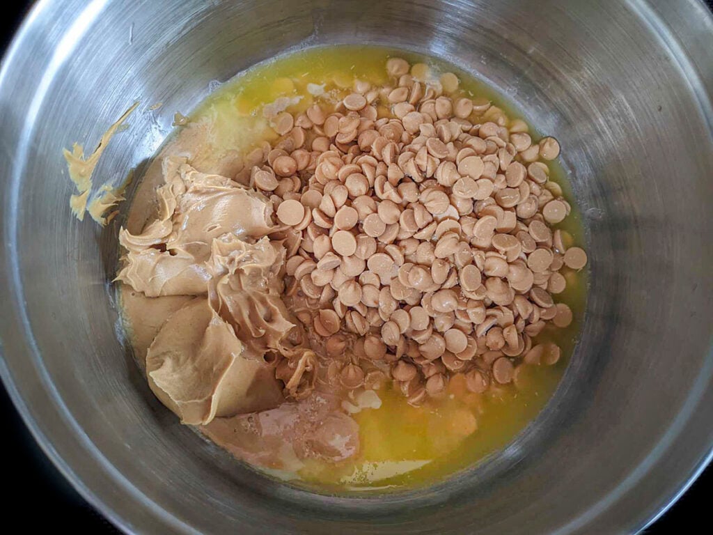 Melted butter, with peanut butter and butterscotch chips in a pot, ready to melt together. 