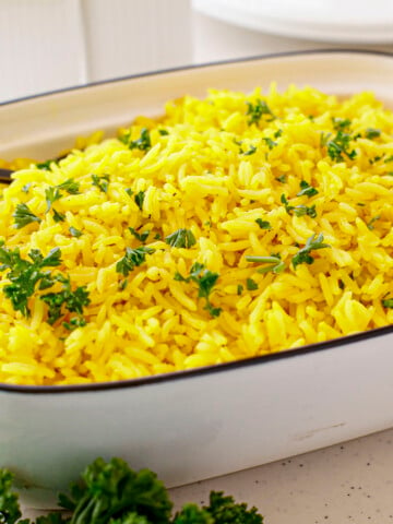 Turmeric Rice in a white serving dish.