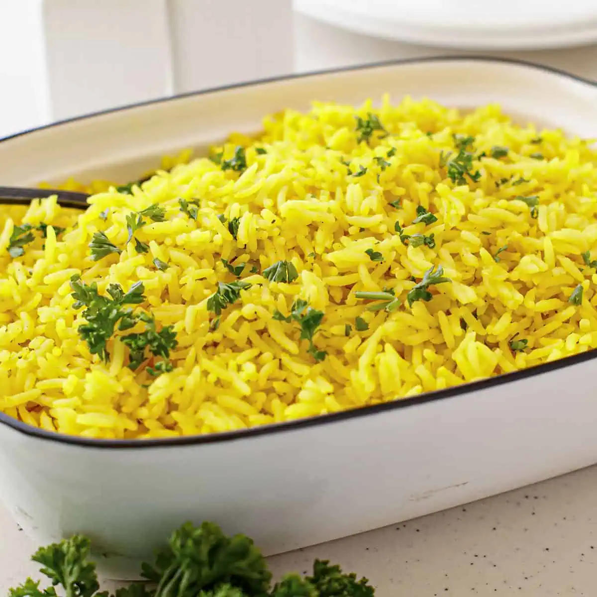 Turmeric Rice in a white serving dish.