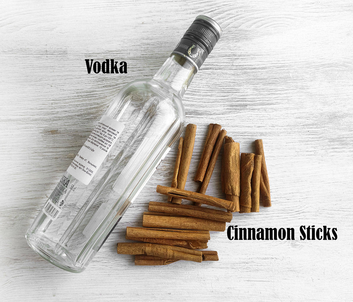 Ingredients for cinnamon extract. Vodka and cinnamon sticks.