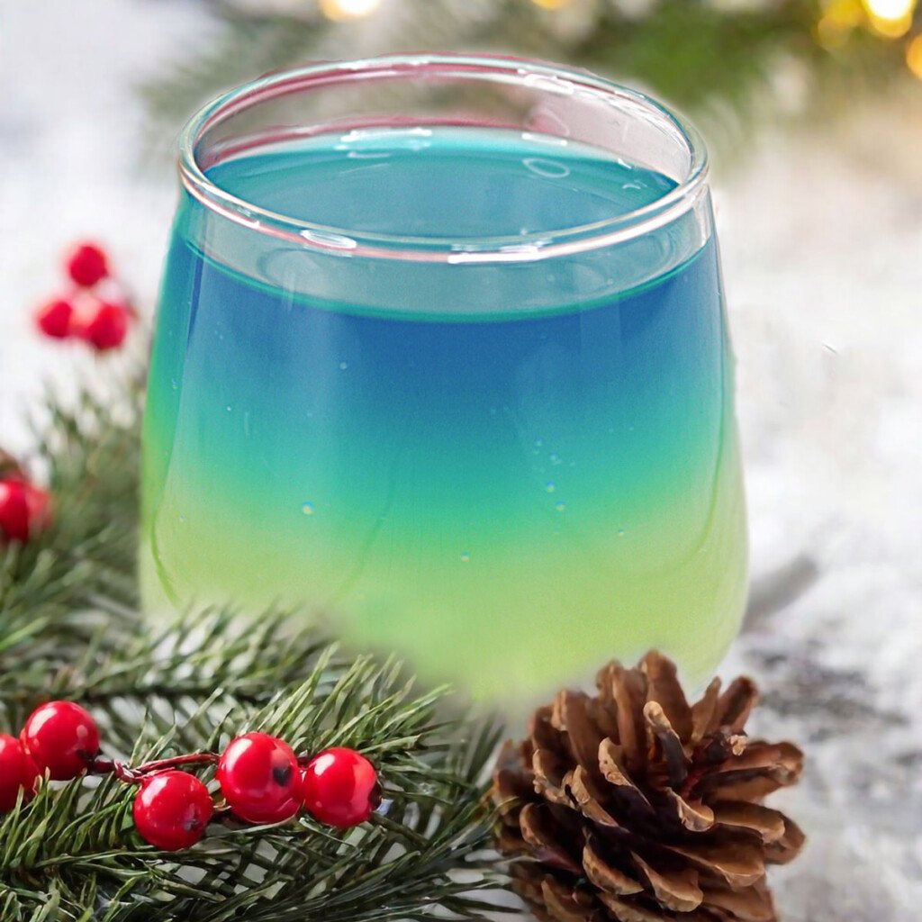 Artic Glow Drop Cocktail in holly branches.