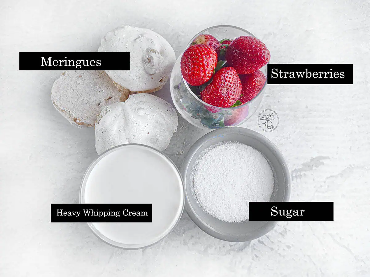 Ingredients for the eton mess parfaits. Meringues, strawberries, sugar, and cream.