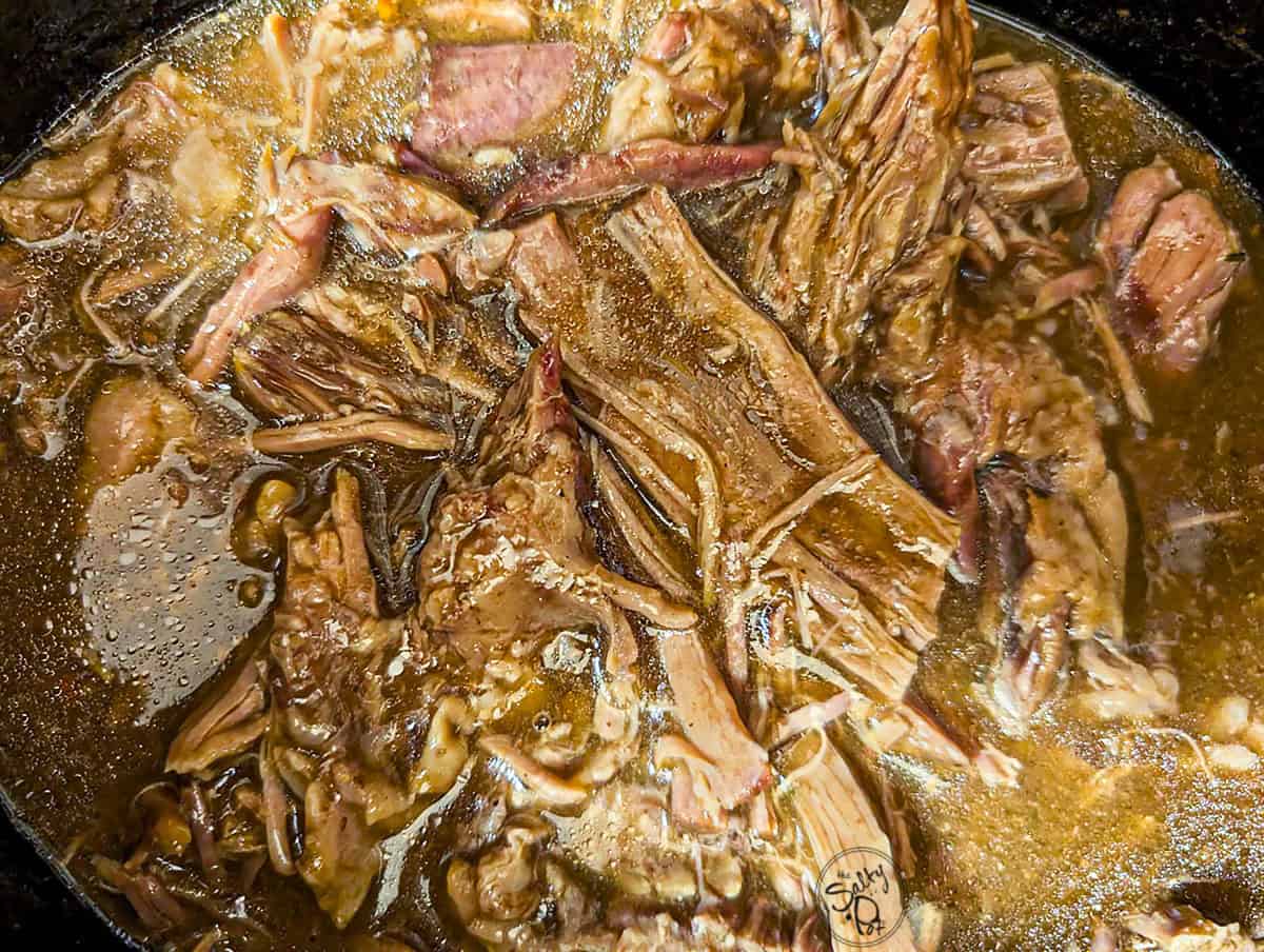 The easy roast beef cooked and shredded in the crockpot.