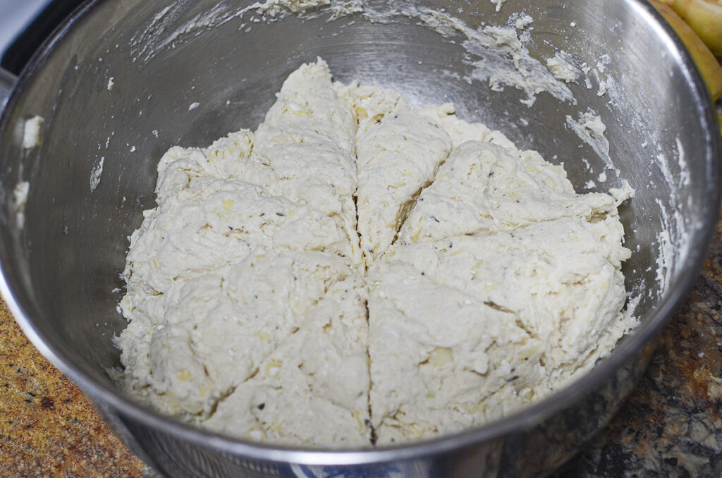 Biscuit topping scored into 8 pieces in a bowl.