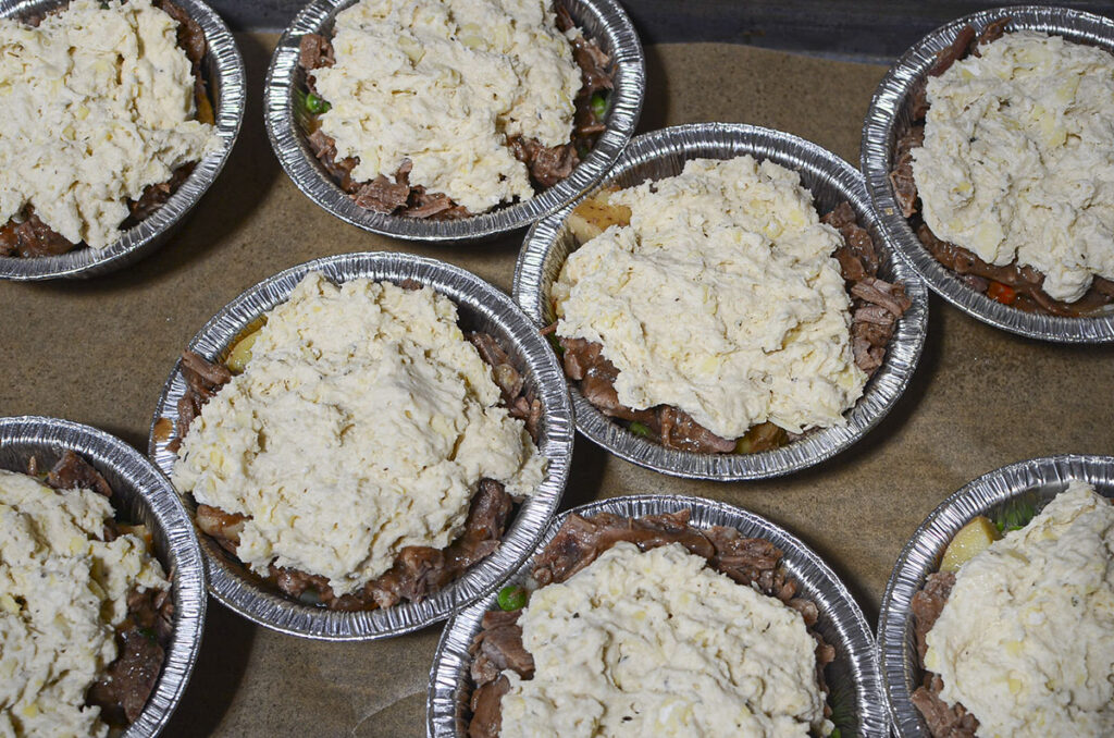 Biscuit topping on top of the beef, ready for the freezer.