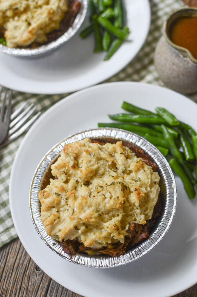 Beet meat pie with green beans in the foil container.