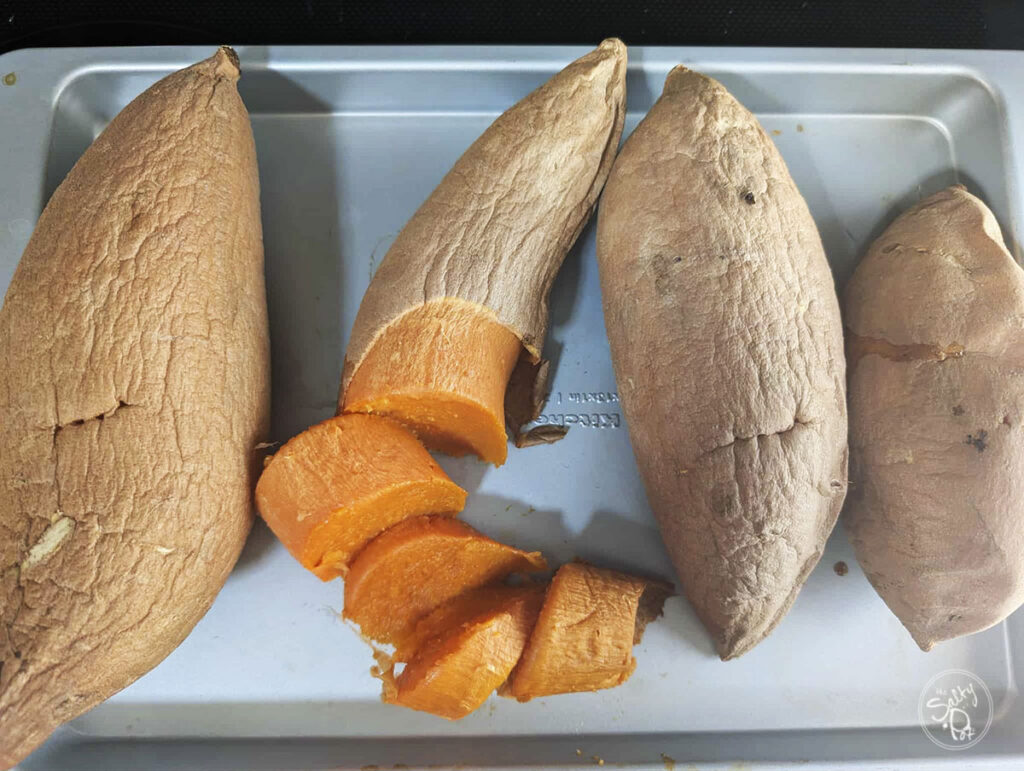 Baked sweet potato on a sheet pan.
