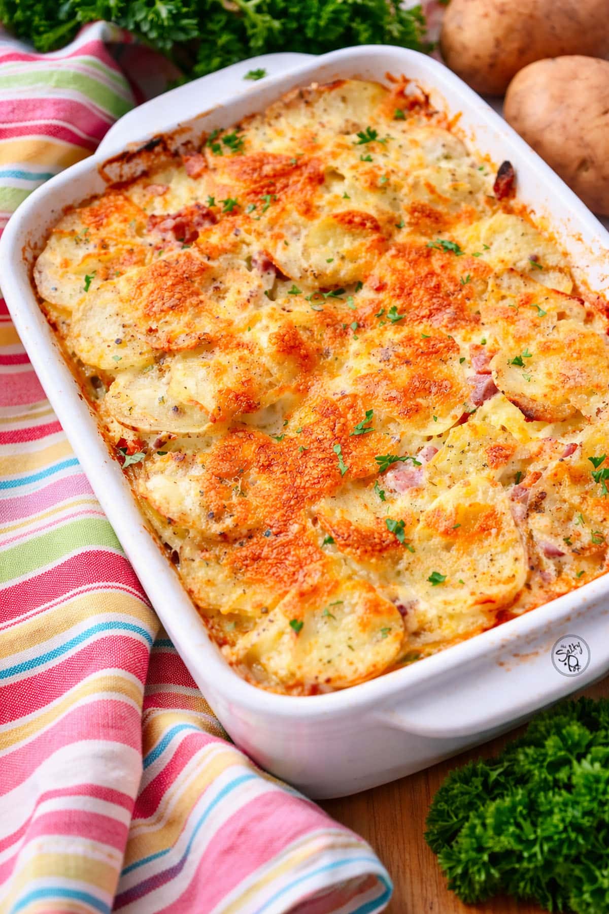 Easy Scalloped Potatoes in a white casserole dish.