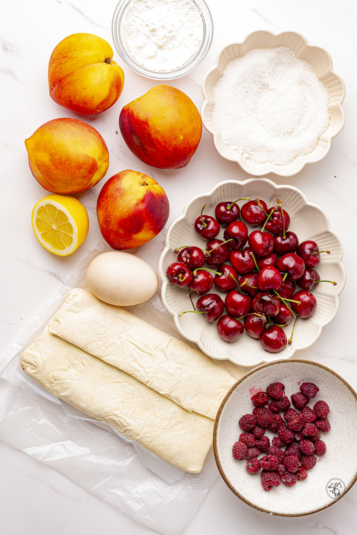 Ingredient Photo. (clockwise) - Nectarines, sugar, cherries, raspberries, puff pastry, egg.