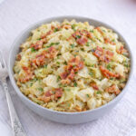 Air fryer cabbage with bacon on a plate.