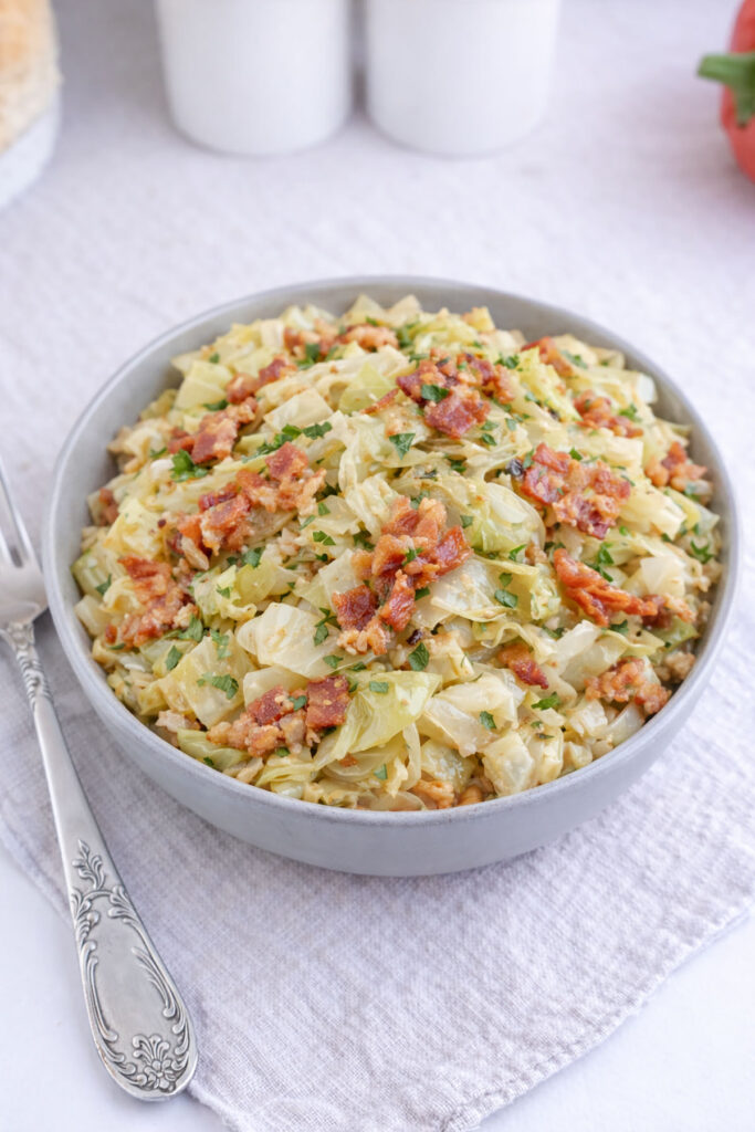 Air fryer cabbage with bacon on a plate.