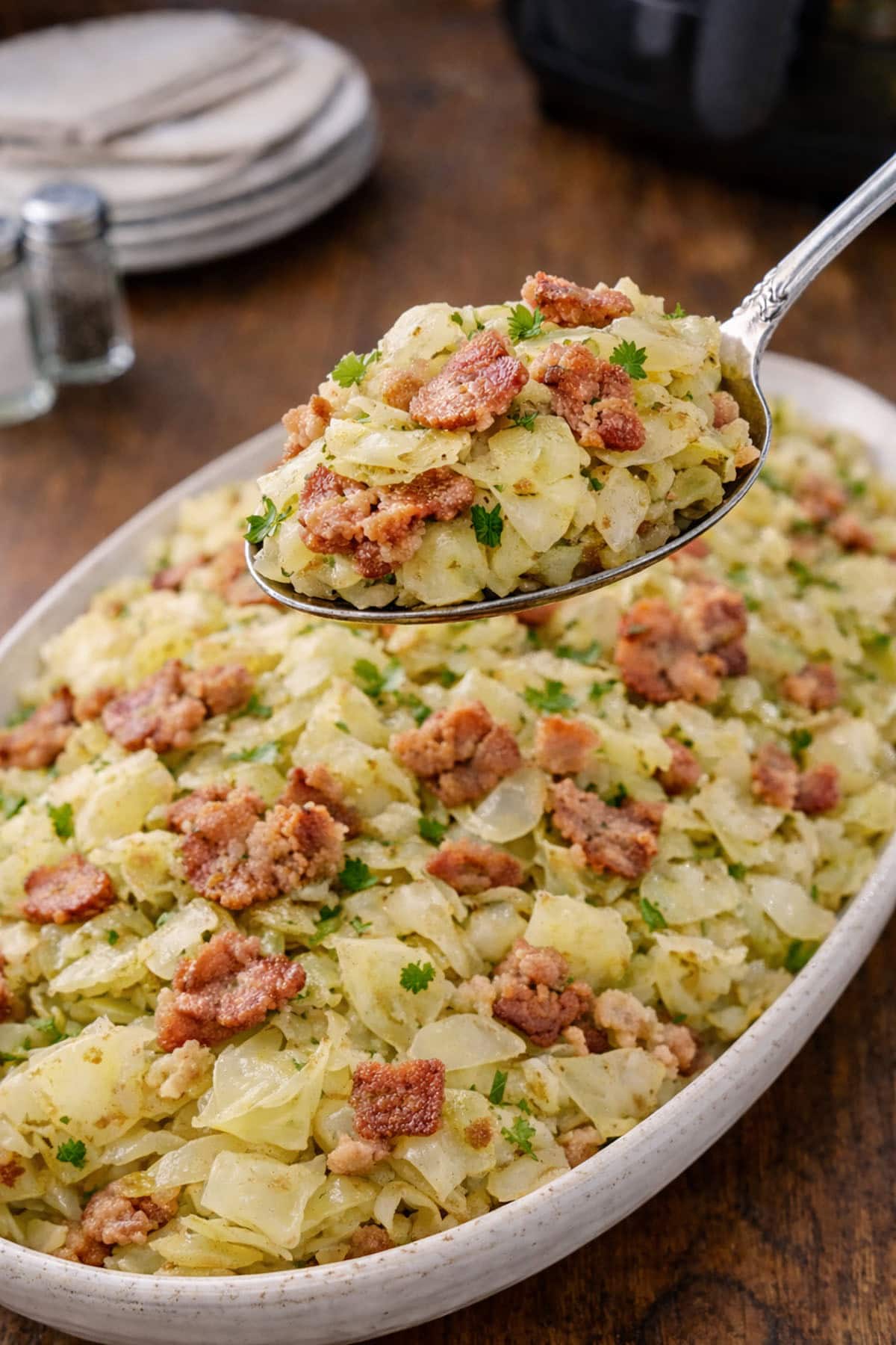 A spoonful of cabbage with bacon.